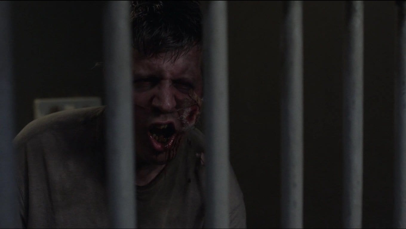 a drunk in a cell mimicking like a bird in Twin Peaks