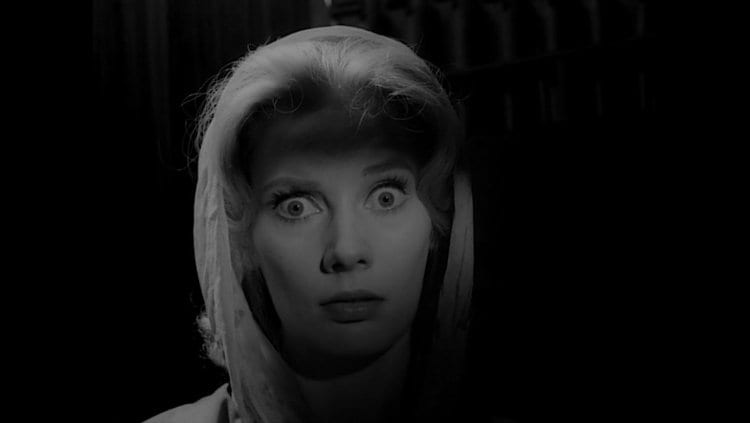 a blonde woman looks startled in Carnival of Souls