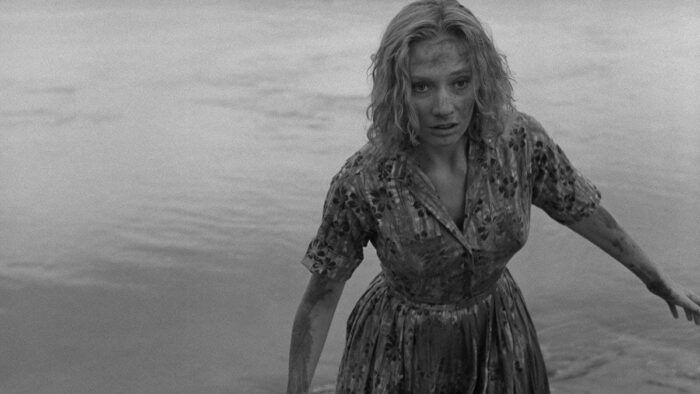 a woman drags herself out of the sea in Carnival of Souls