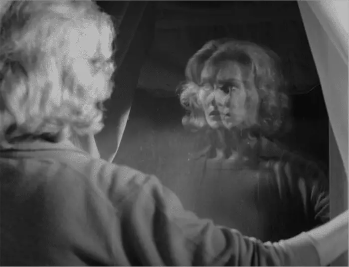 Melinda in Carnival of Souls looks in the mirror and sees duplicates of herself