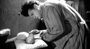 Henry tries to take care of his baby in eraserhead