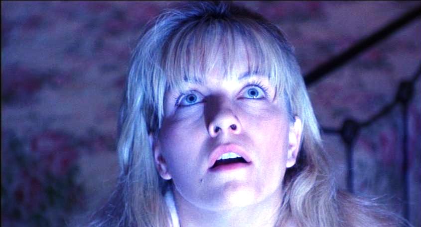 Laura Palmer looks up to her bedroom ceiling in wonder