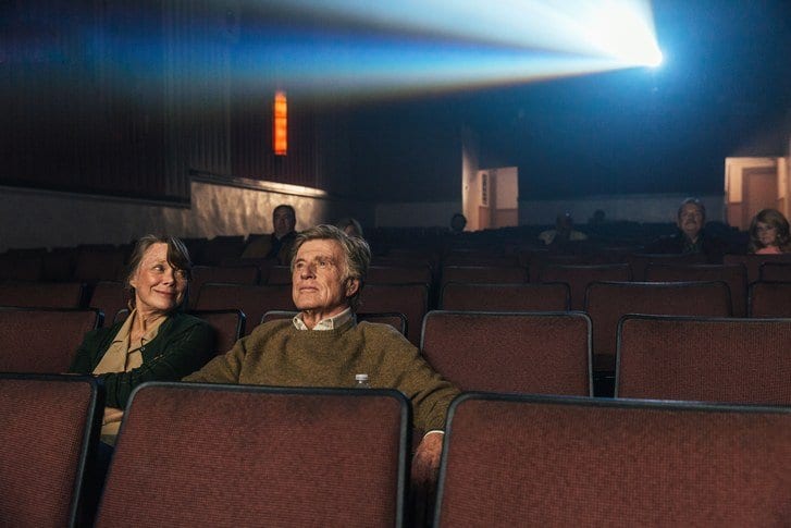 Sissy Spacek and Robert Redford sitting in a cinema in The Old Man & the Gun