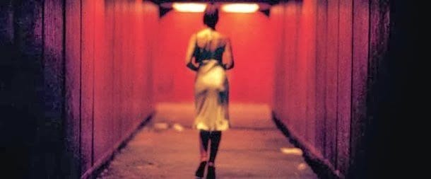 a woman walks down a dark underpass in Irreversible, Gaspar Noe