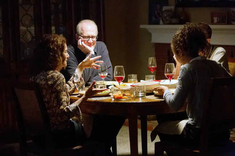 Tracy Letts as Michael in The Lovers as he sits with his partner and another couple at dinner