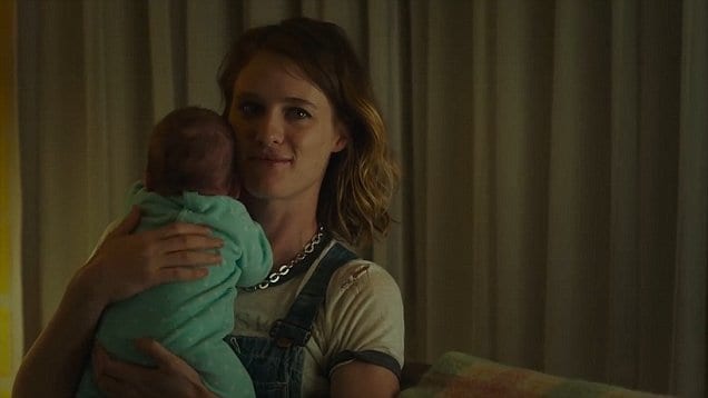 Mackenzie Davis stars as the titular Tully, cuddling a new born baby