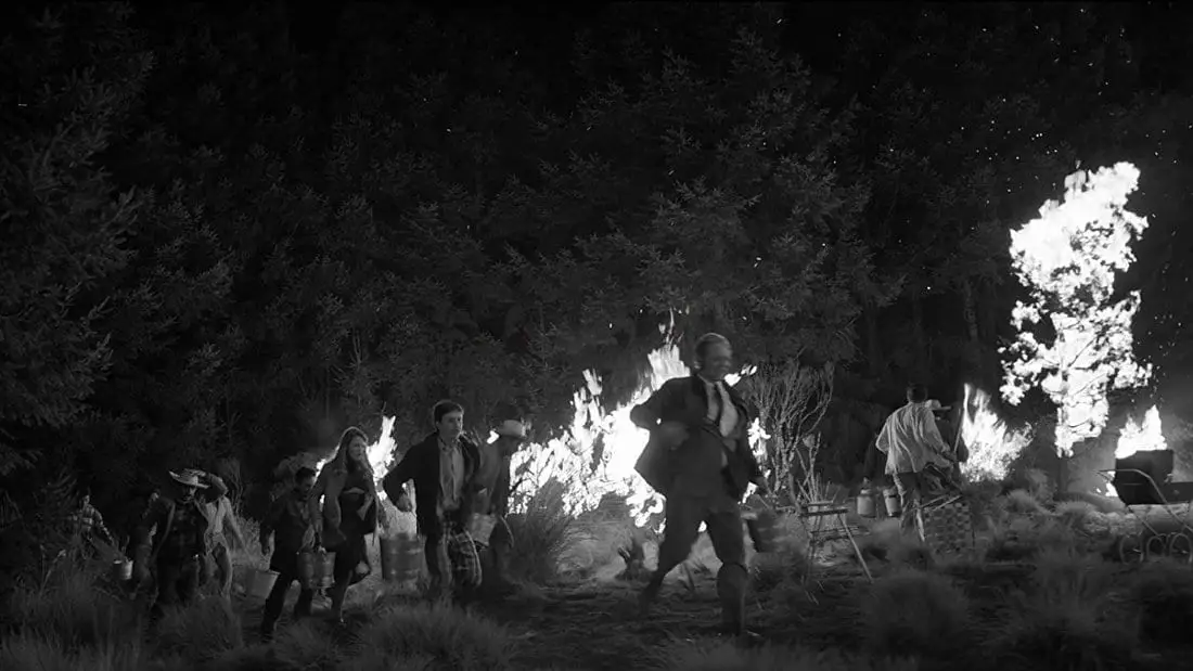 A fire rages in this still from Roma.