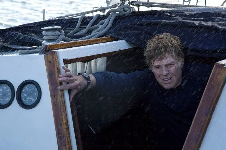 Robert Redford on a small boat on the sea in a storm in J. C. Chandor's All Is Lost