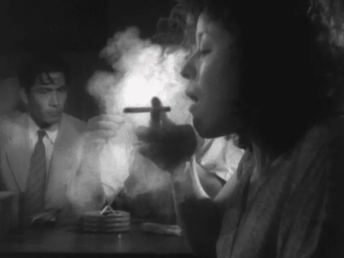 Murakami (Toshiro Mifune) looks on as leads to his stolen Colt go up in smoke in Akira Kurosawa's Stray Dog