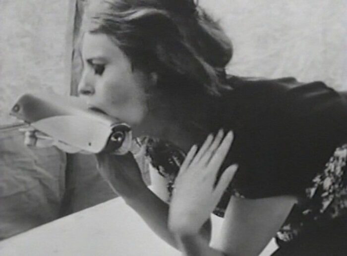 Woman licking a shoe in Multiple Maniacs