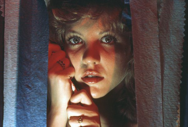 Chris Hargensen (Nancy Allen) prepares for the pig's blood to fall in Brian DePalma's Carrie (1976).
