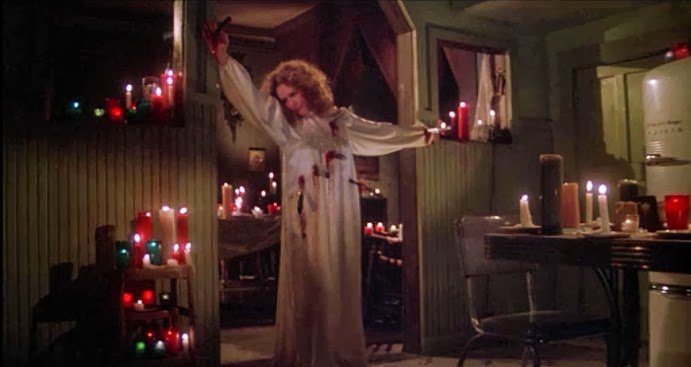 Margaret White (Piper Laurie) gets the best death in Brian DePalma's Carrie (1976).
