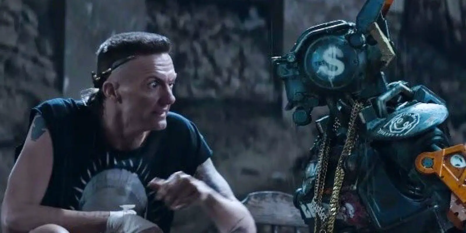 Ninja has a quiet moment with Chappie, explaining how he needs to help with the heist to get a new body