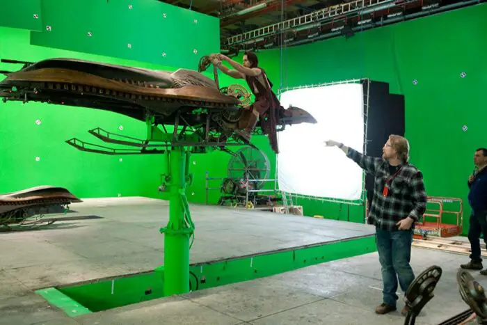 Director Andrew Stanton gives Taylor Kitsch guidance on the green screen stages.