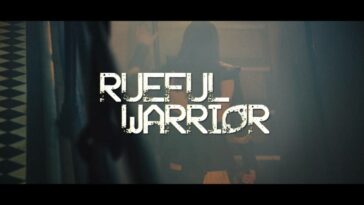 The film's title, Rueful Warrior, is superimposed over the film's opening scene: Yalalia (Michelle Fahrenheim) walking up a stairwell.