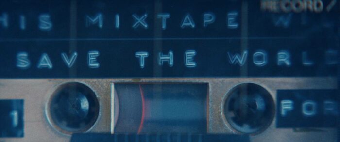 A cassette mixtape left by Grace plays containing music capable of thwarting an invading alien threat.
