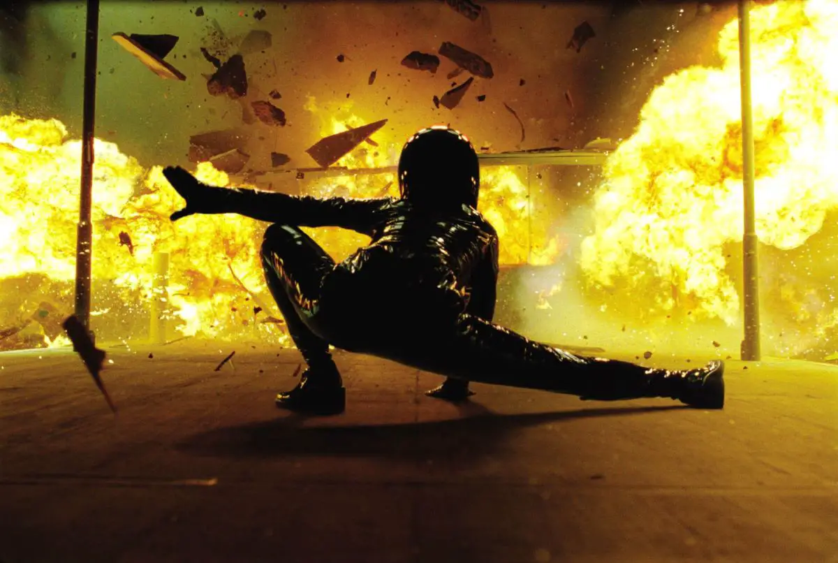 Trinity lands in front of an explosion in The Matrix Reloaded