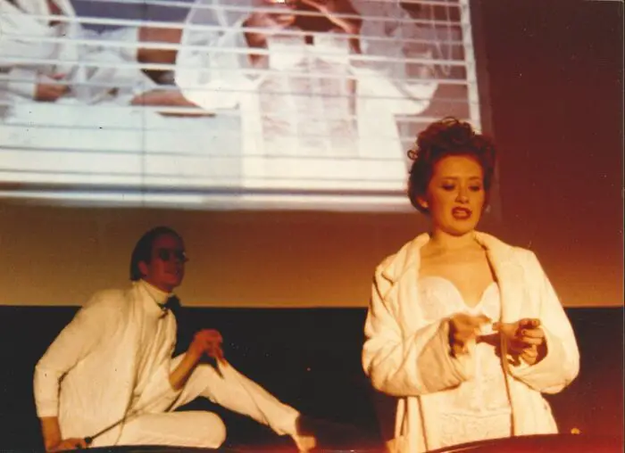 Kerry D. (as Nation McKinley) and another Shock Treatment cast member perform the "Lullaby" scene from Shock Treatment.