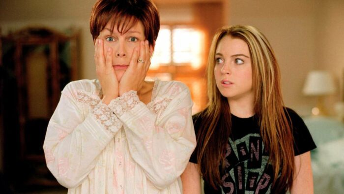 Jamie Lee Curtis with Hands On Her Face and Lindsay Lohan Staring At Her In Concern, in Freaky Friday