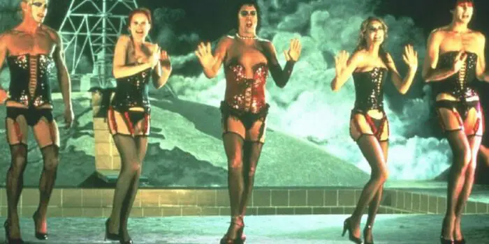 Closing number with cast of The Rocky Horror Picture Show on stage dancing in corsets