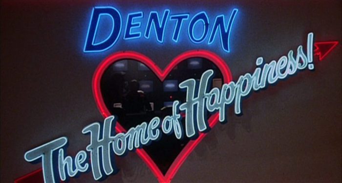 The Neon Home of Happiness sign glows in "Shock Treatment"