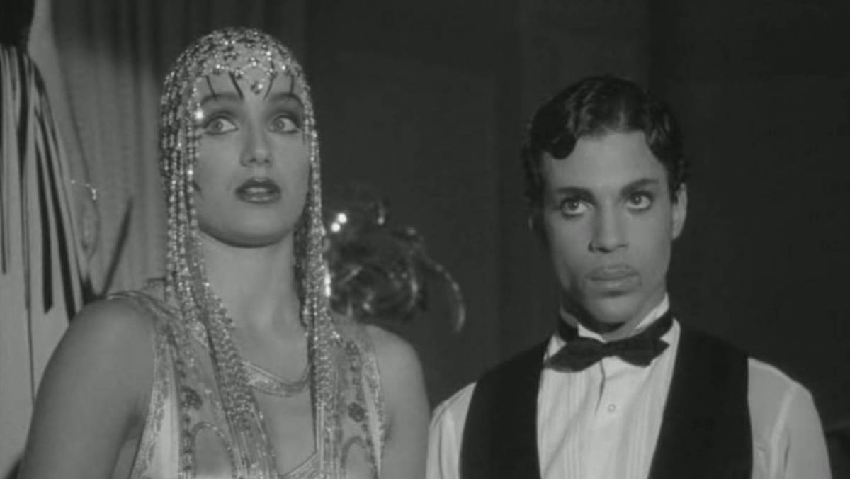 Mary Sharon (Kristin Scott Thomas) and Christopher Tracy (Prince) look off into the distance in Under the Cherry Moon.