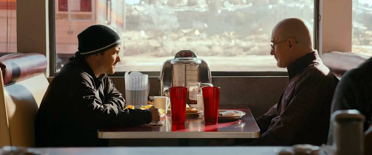 Walt and Jesse sit in a diner booth eating breakfast