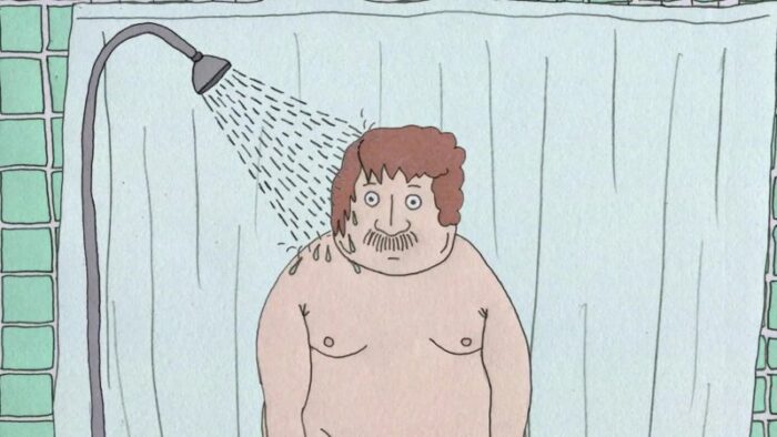 A large man stares wide-eyed under a running shower