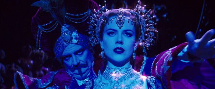 Satine (Nicole Kidman) sings while Harold Zigler (John Broadbent) watches in Moulin Rouge.