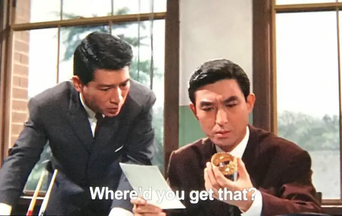 Shindo from Ghidorah looking at the Princess's golden bracelet