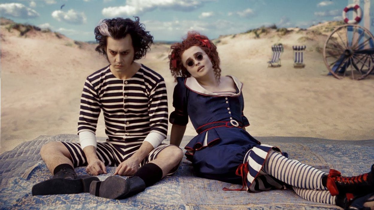 Sweeney and Mrs Lovett by the sea, in bathing dresses. She is happy, he is brooding.