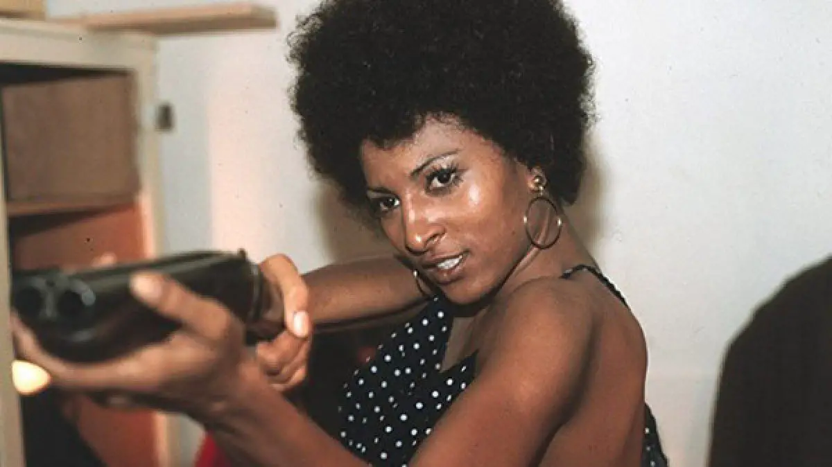Coffy (Pan Grier) Is Levelling A Sawed Off Shotgun At An Unknown Assailant. 