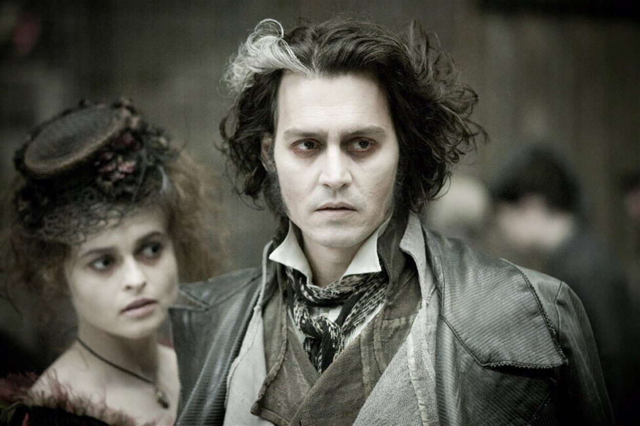 Todd scopes out something in the marketplace, with Mrs Lovett at his side
