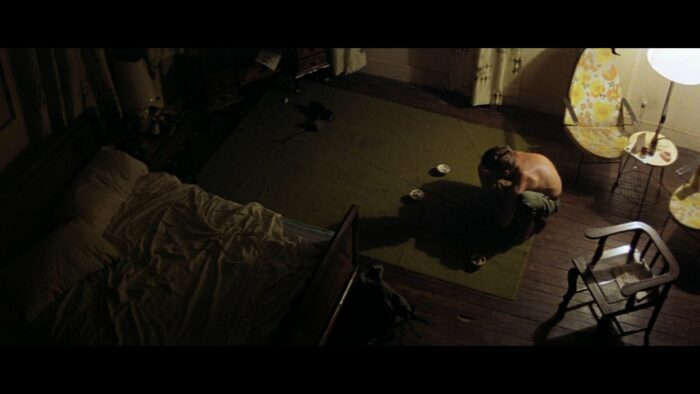 Martin Sheen as Willard in hotel room