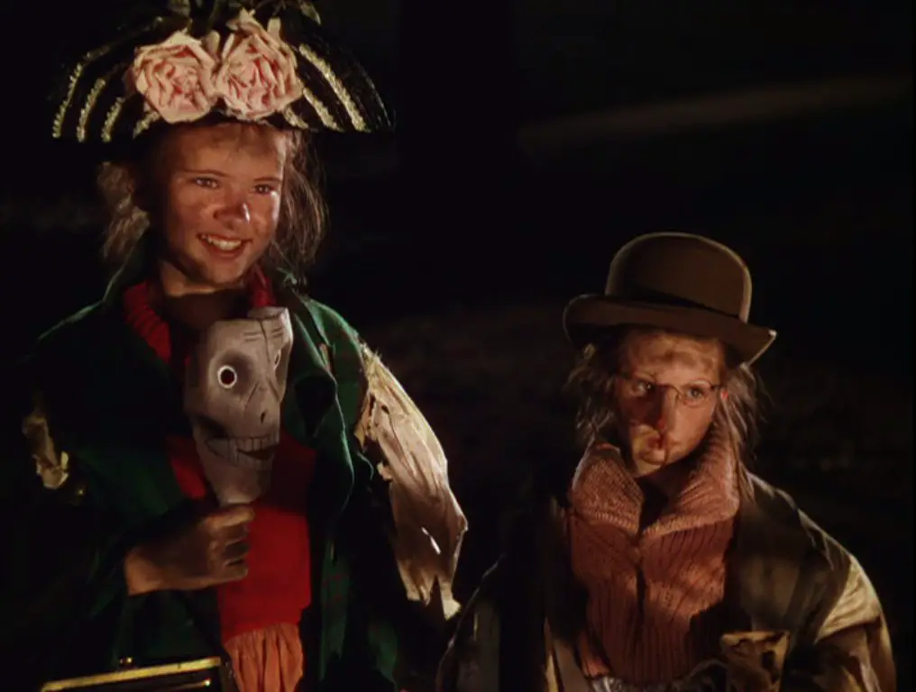 Tootie and Agnes are dressed in homemade Halloween costumes, their faces smudged with dirt