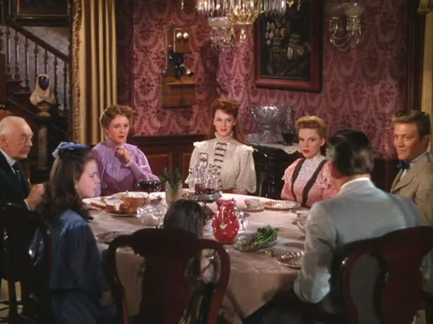 The Smith family sits around a large table for dinner in their dining room