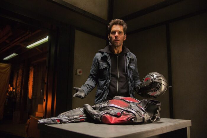 Scott Land stands in a room with the Ant-Man costume, confused