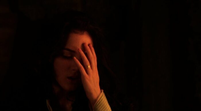 Mina Harker (Winona Ryder) touches her forehead, feeling where a scar once was in Bram Stoker's Dracula.