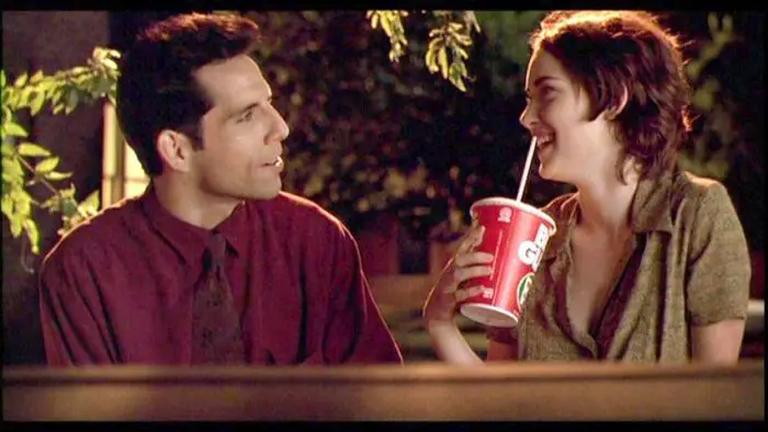 Michael and Lelaina in Reality Bites converse; Lelaina sips a Big Gulp soda