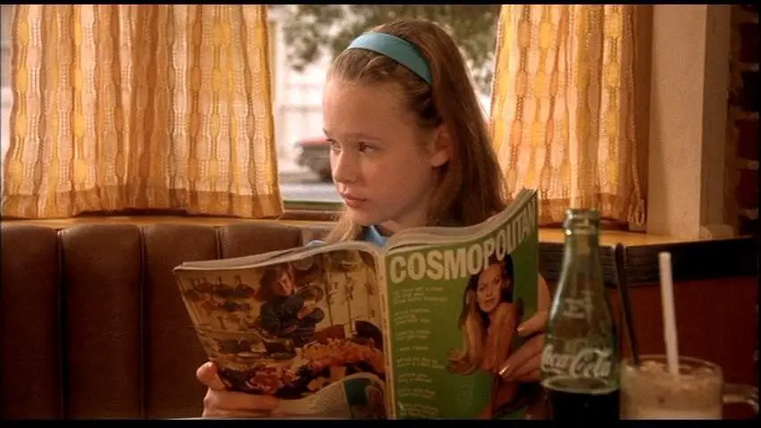 Teeny reads an issue of Cosmopolitan. 