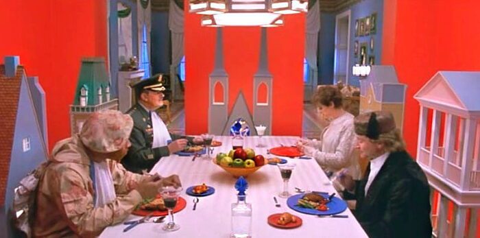 Leslie Zevo, Alsatia, The General and his son Patrick sit down at a table for a colorful meal