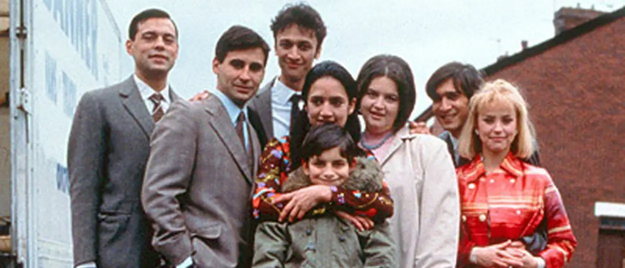The Khan family stand together on the street