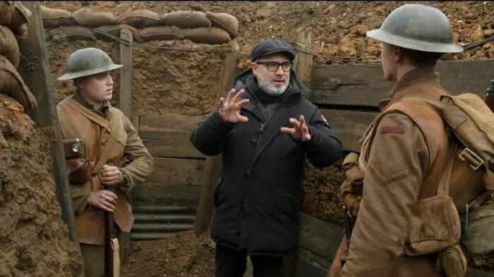 Director Sam Mendes gives instructions to two actors in between takes in the trench scenes.