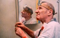 William S. Burroughs acts out a scene from Naked Lunch in Burroughs: The Movie