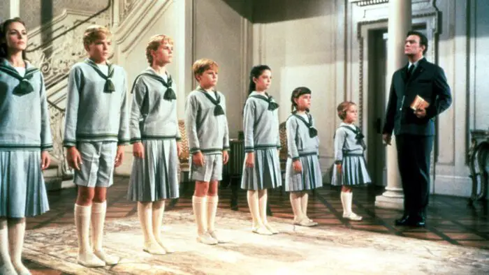 All the Von Trapp kids standing in line to attention