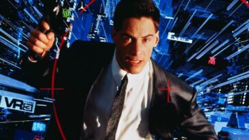 Keanu Reeves holding a gun in the cyberspace world of Johnny Mnemonic
