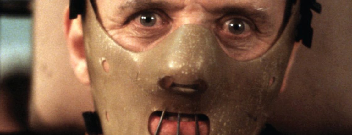 Dr. Lecter being transferred, wearing his face mask that only leaves his eyes uncovered