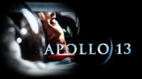 promotional image of the apollo 13 movie. Tom hanks looking to the side through his space helmet