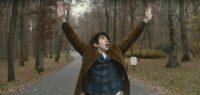 Jamie Schwartz screams with exasperation in the middle of a forest road.
