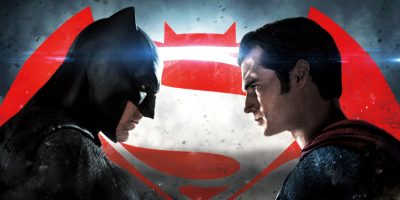 Batman and Superman standing face to face